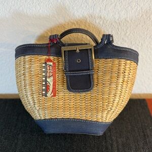 Bath & Body Works seagrass tote bag with denim-style blue‎ trim buckle closure.